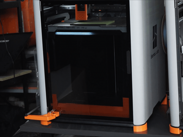 FarmLoop Stage 2 ejecting a printed box from a Bambu Lab H-Series printer, door opening and plate clearing automatically